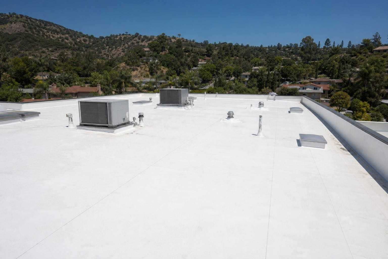 A broad commercial low-slope roof viewed from above.