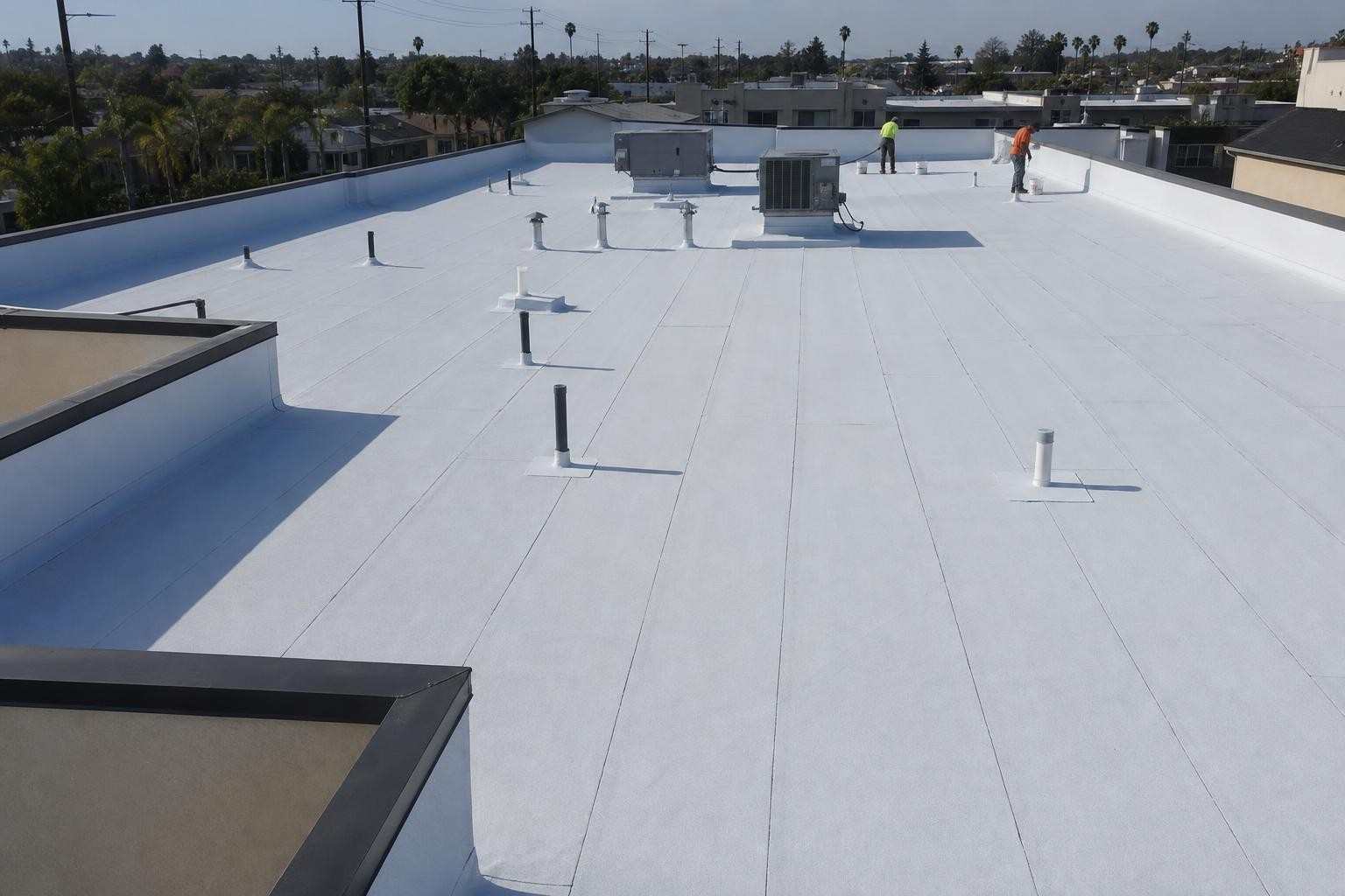 Roofing work underway across a commercial roof.