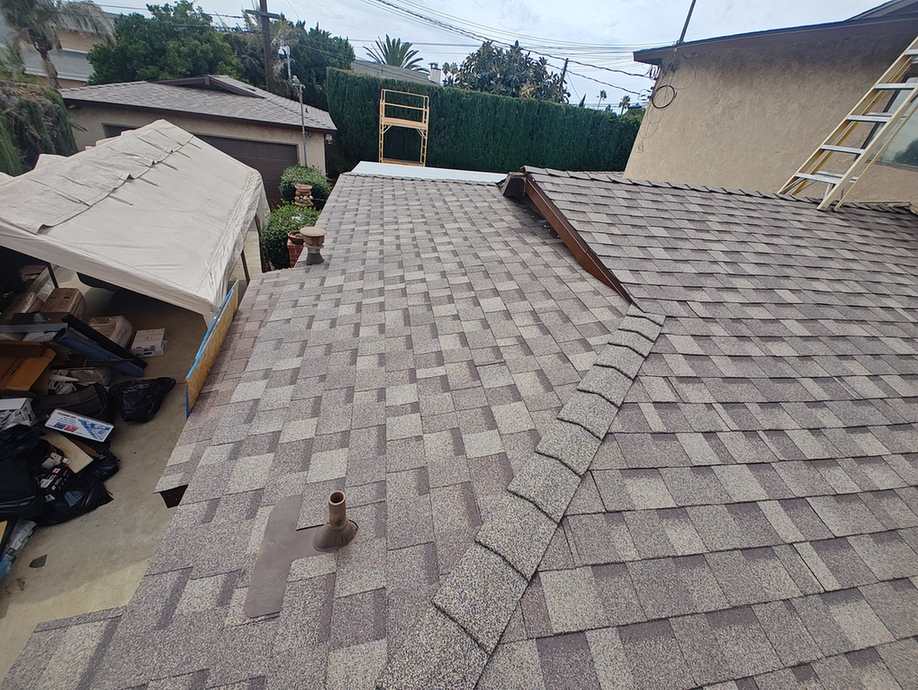 Multitone architectural-shingle roof planes.