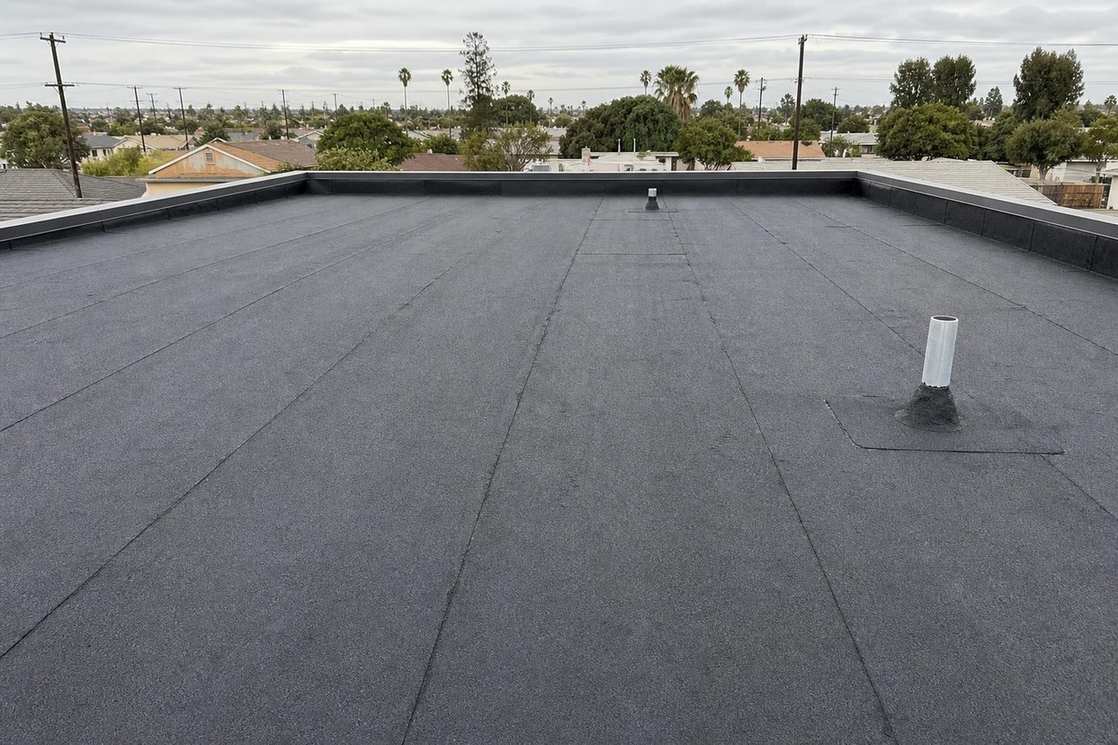 A finished low-slope roof on a residential building.