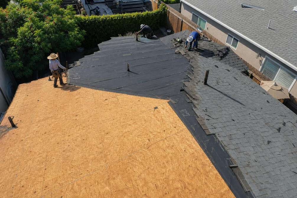 An exposed roof deck during a roof replacement.