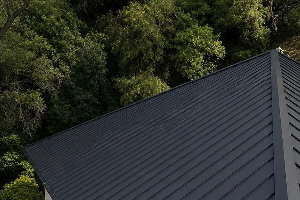 Finished standing-seam metal roof panels.